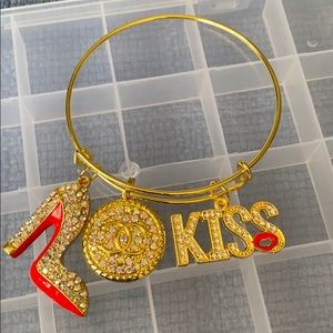 Gold plated bangle with charms